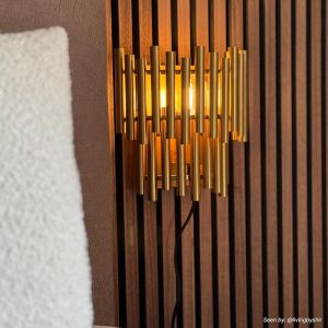 Modern vägglampa mässing, Joelle, med brytare